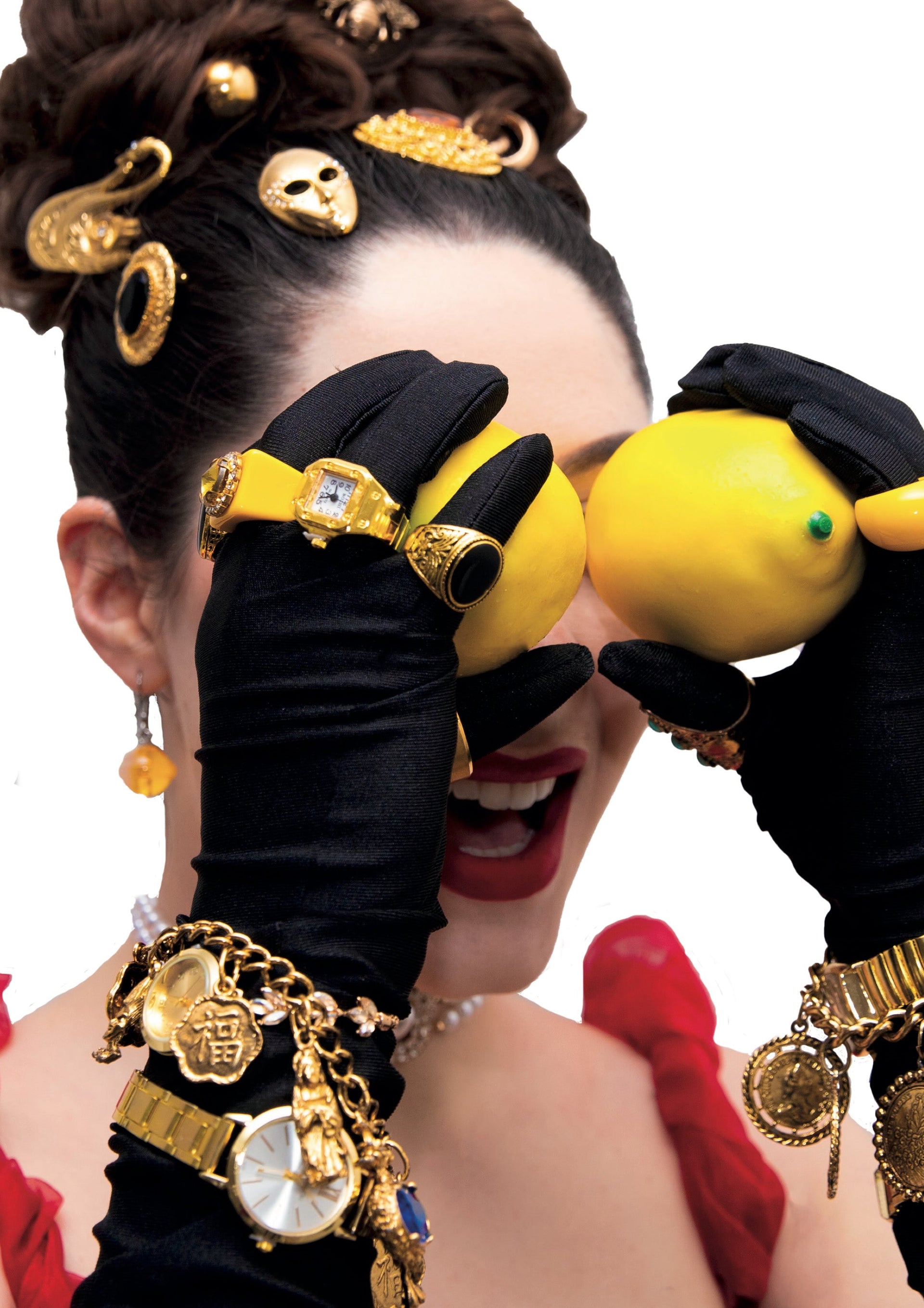 Person wearing black gloves with yellow lemon-shaped objects and gold accessories, with 'LemonBelly' branding.